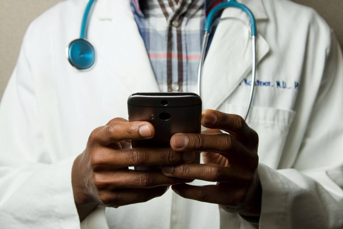 Doctor holding phone